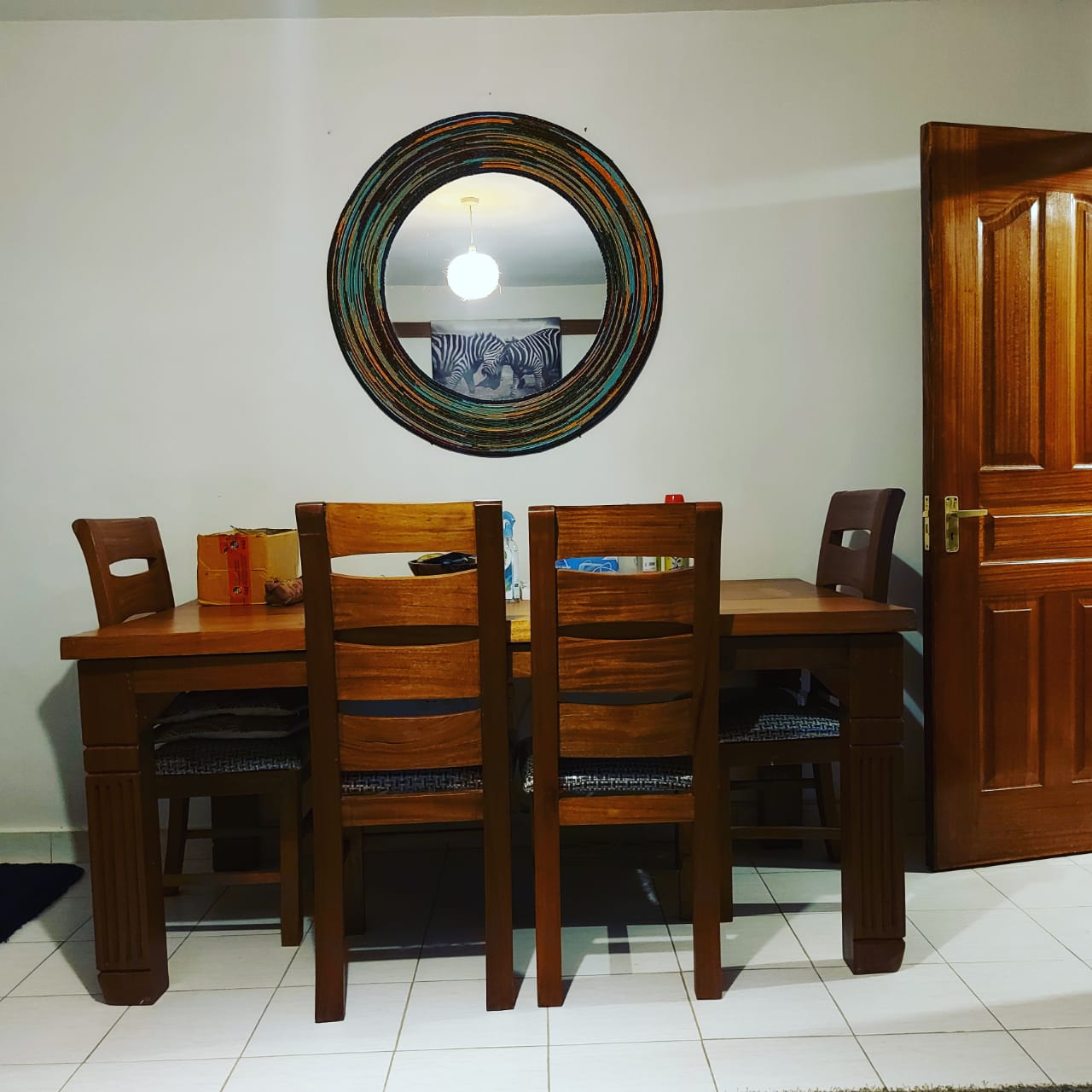 Teal and orange beaded mirror