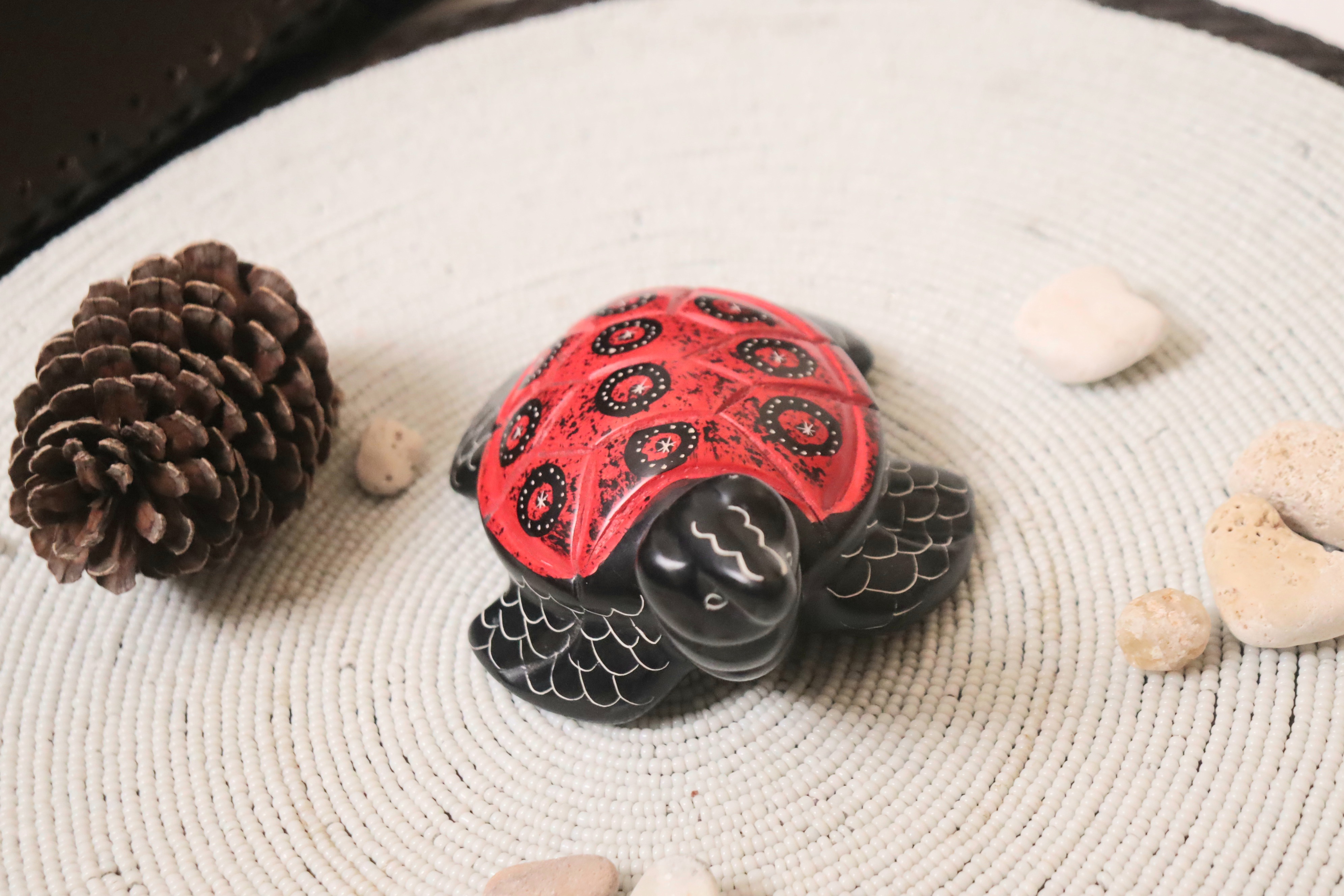 Red soapstone turtle.