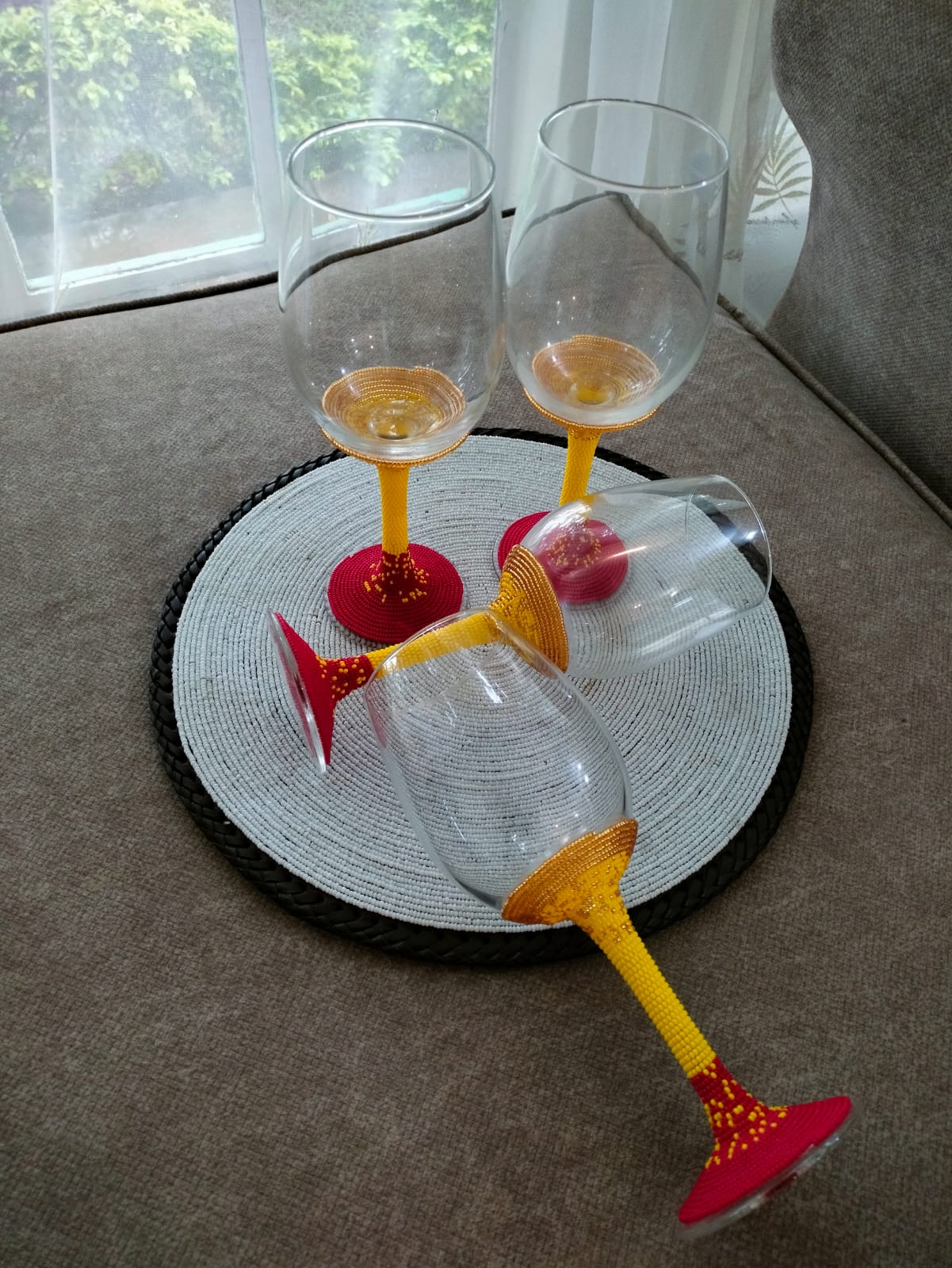 Handcrafted yellow beaded wine glasses