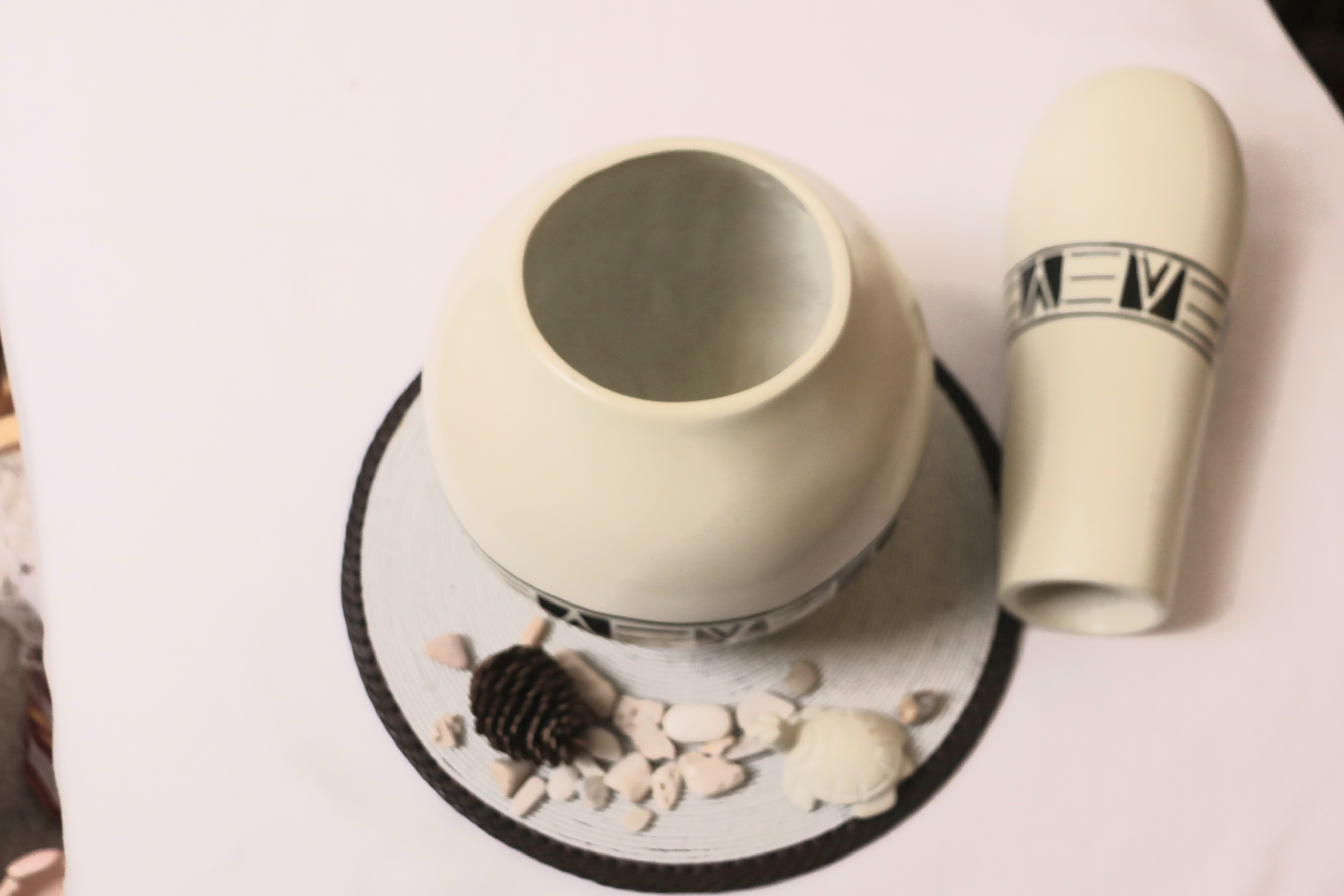 Elegant circular soapstone white vase.