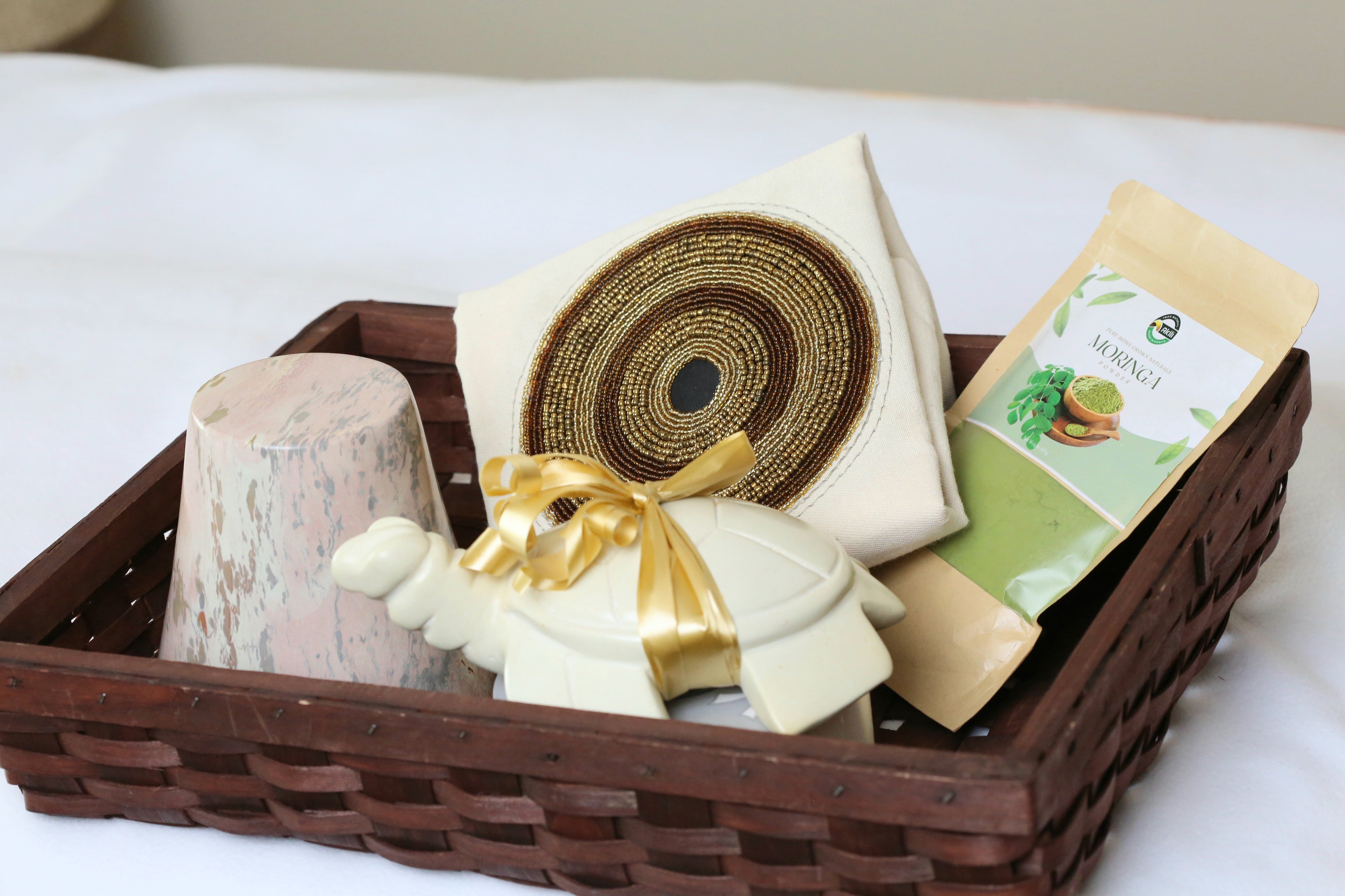 Basket with Soapstone planter, turtle, pillow cover and Moringa seeds package